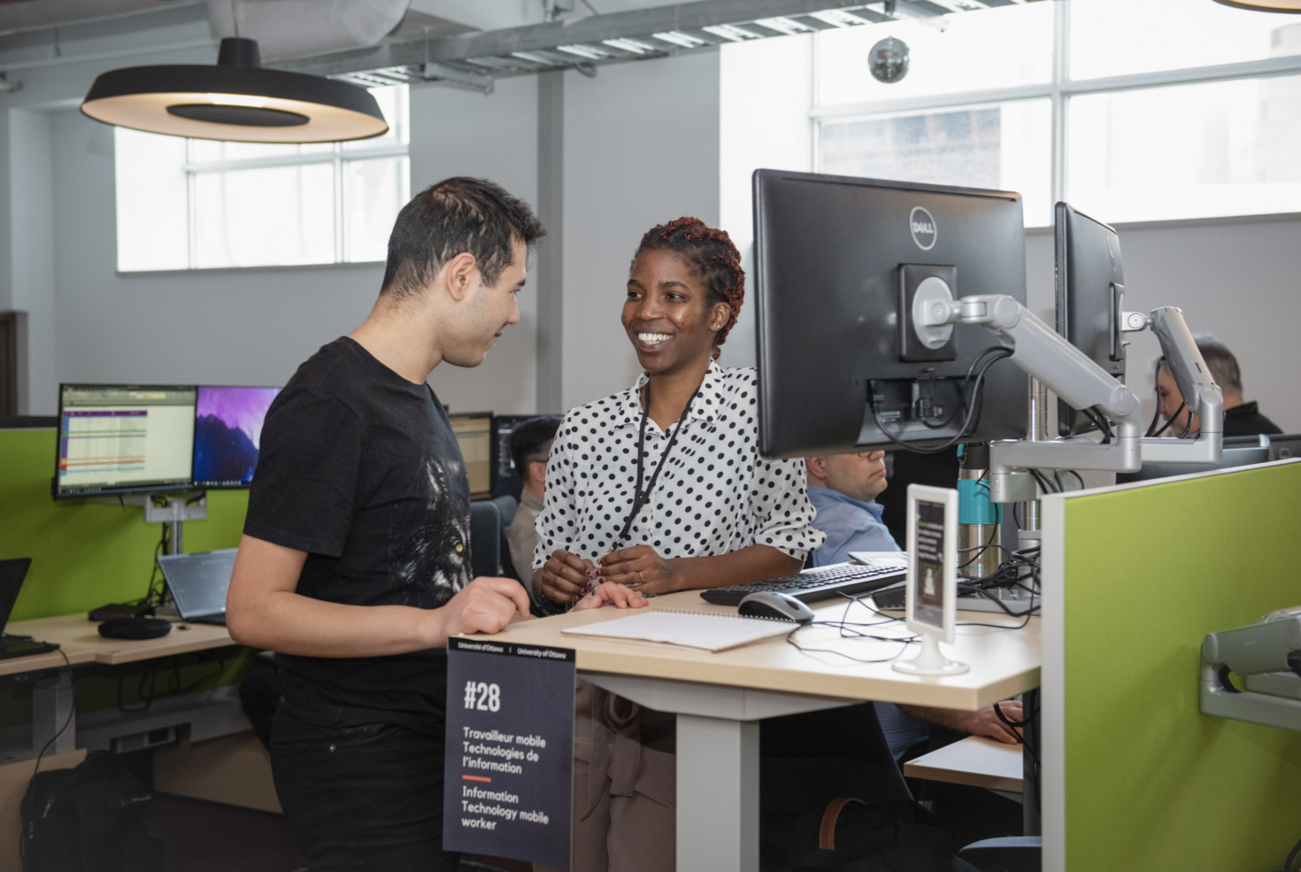 staff working at stand up desk