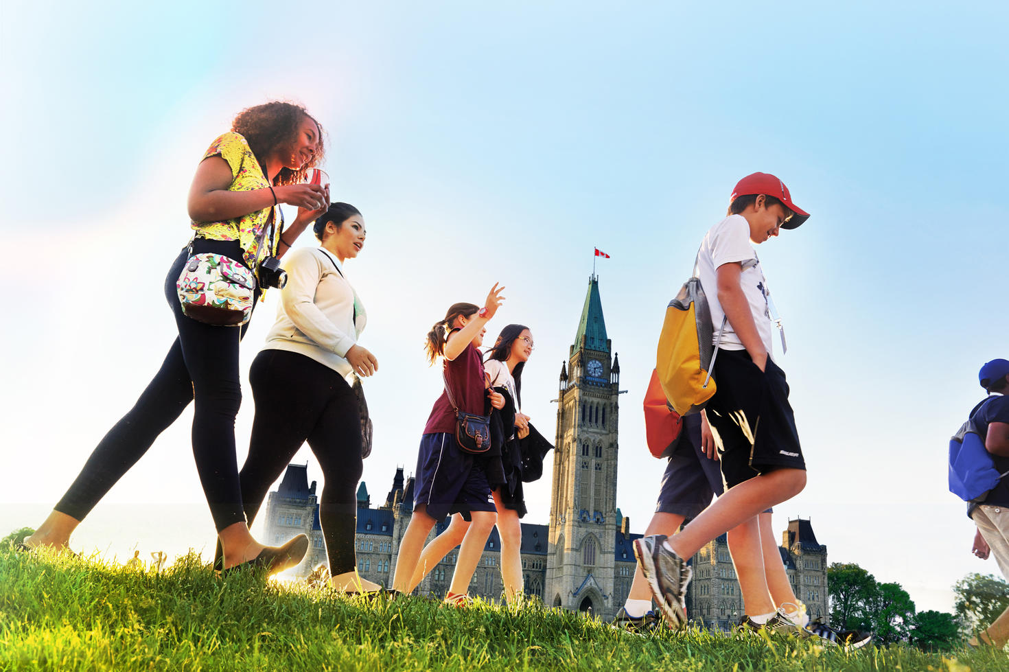 Students walking in front of Parliament Hill.