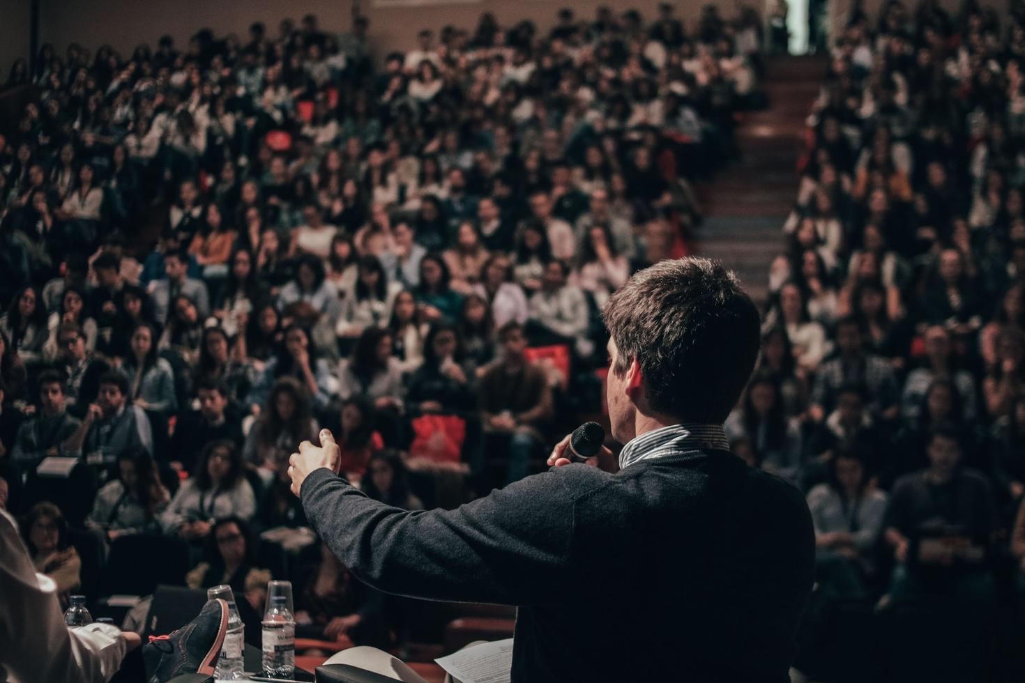 a professor giving a lecture in an auditorium