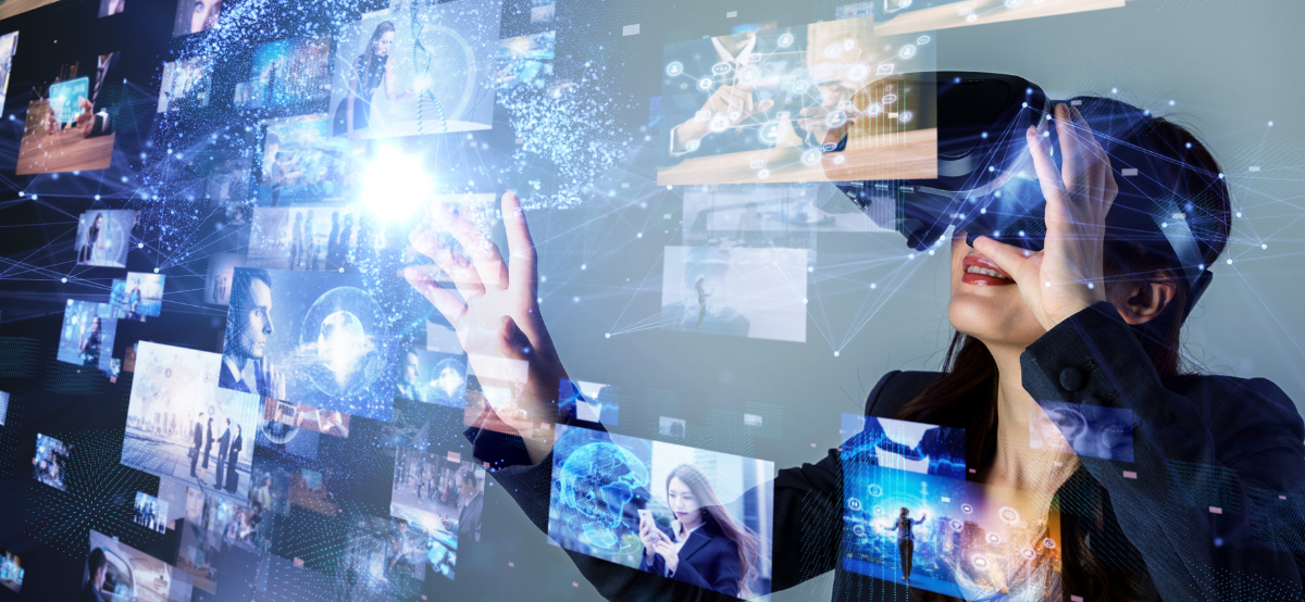 Hand against reflective screen with various technological images