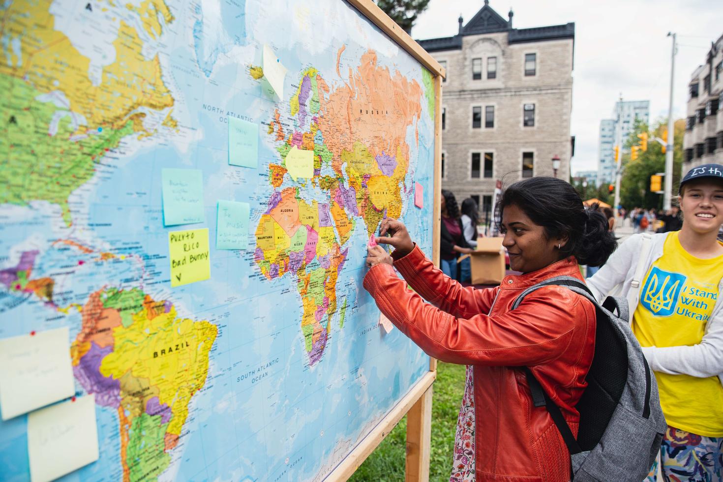 Student with a world map