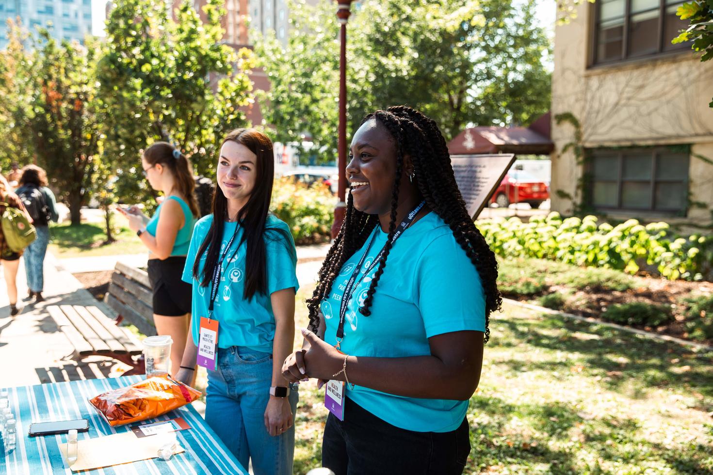 Two students working at a booth