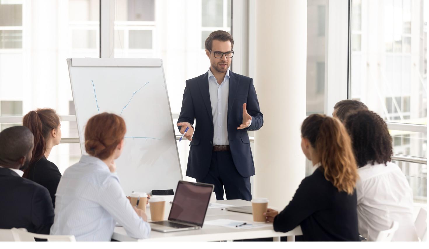 Man speaking to work colleagues