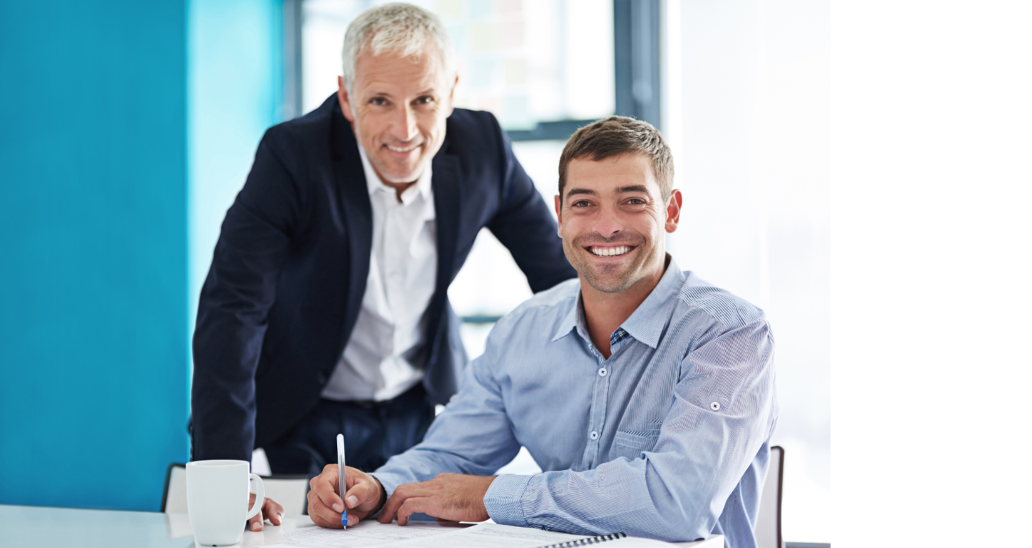 An office worker next to a younger colleague 