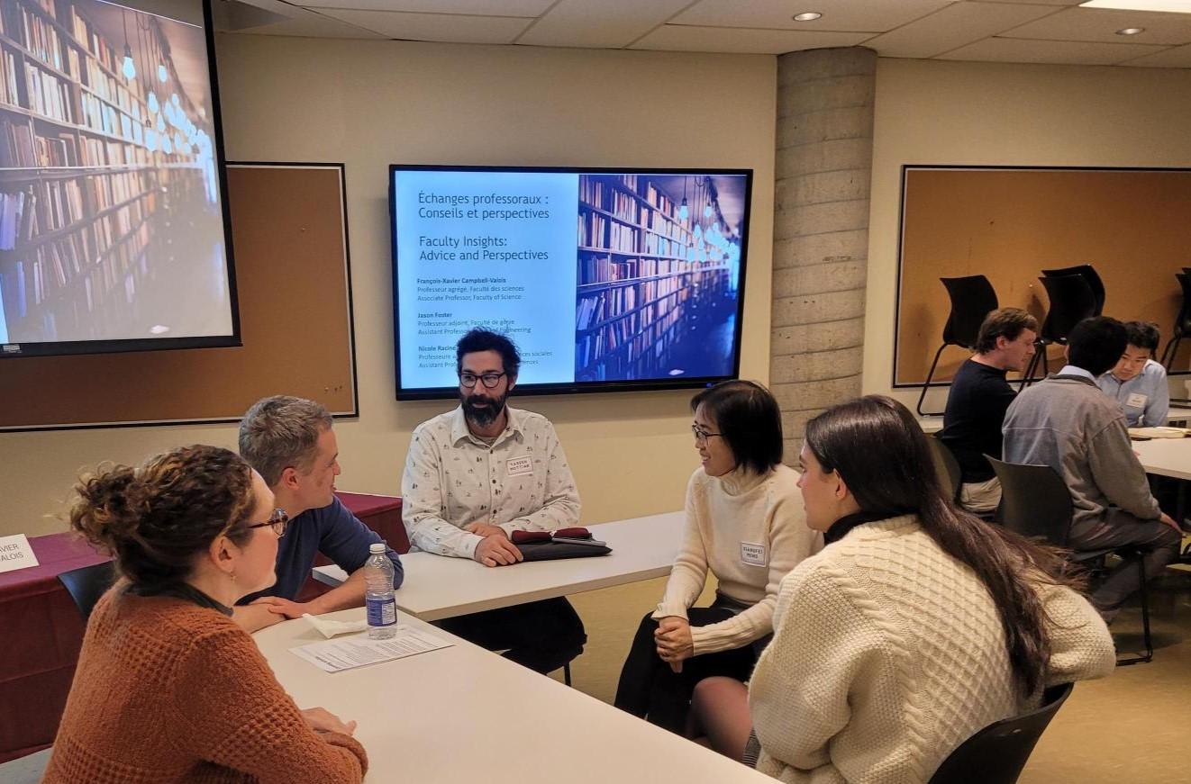 professors talking around a table