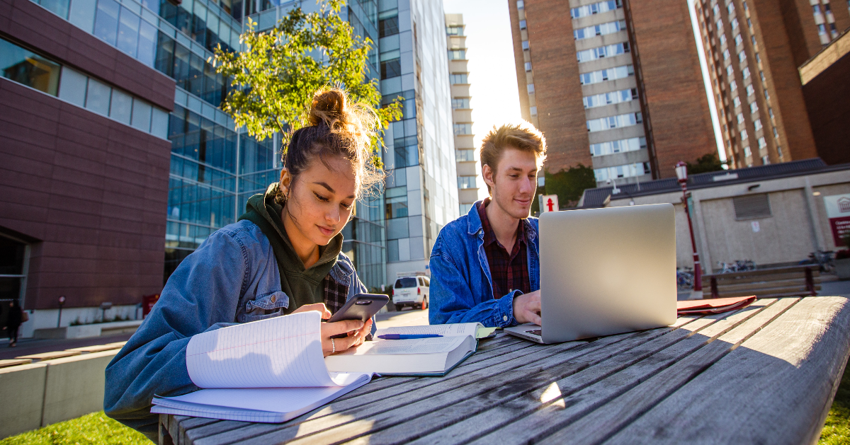 Two students studying outside