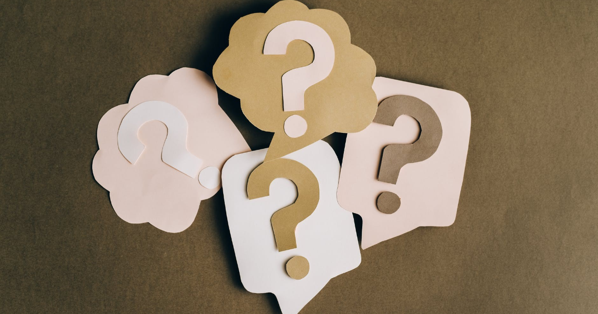 Four bubbles with question marks