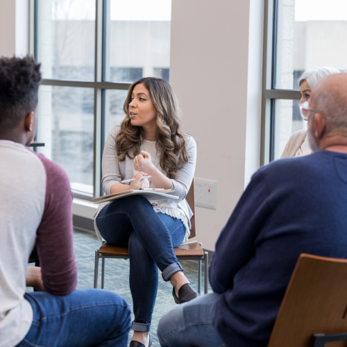 woman talking to group