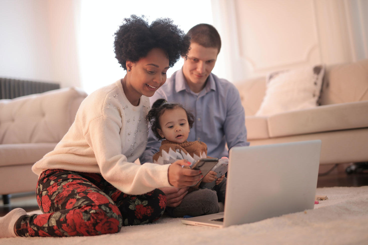 Family looking at a laptop