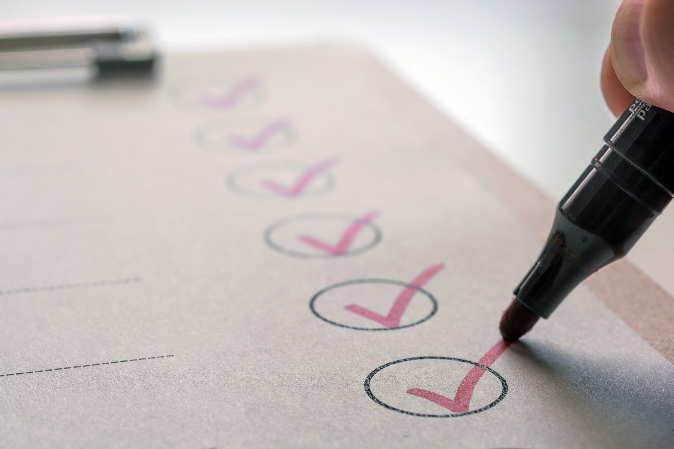 Checklist with red marker