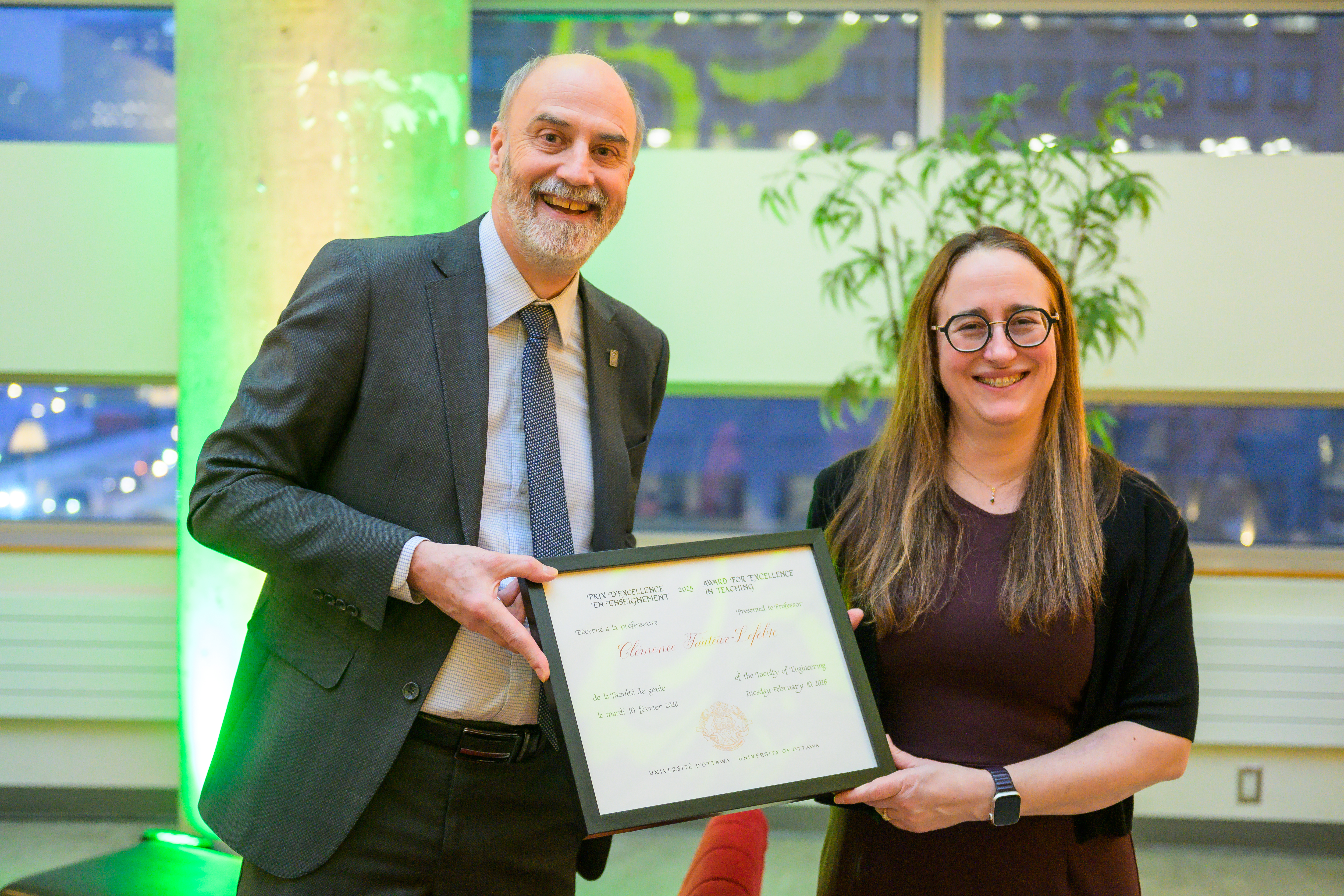 Jacques Beauvais handing a prize to a professor