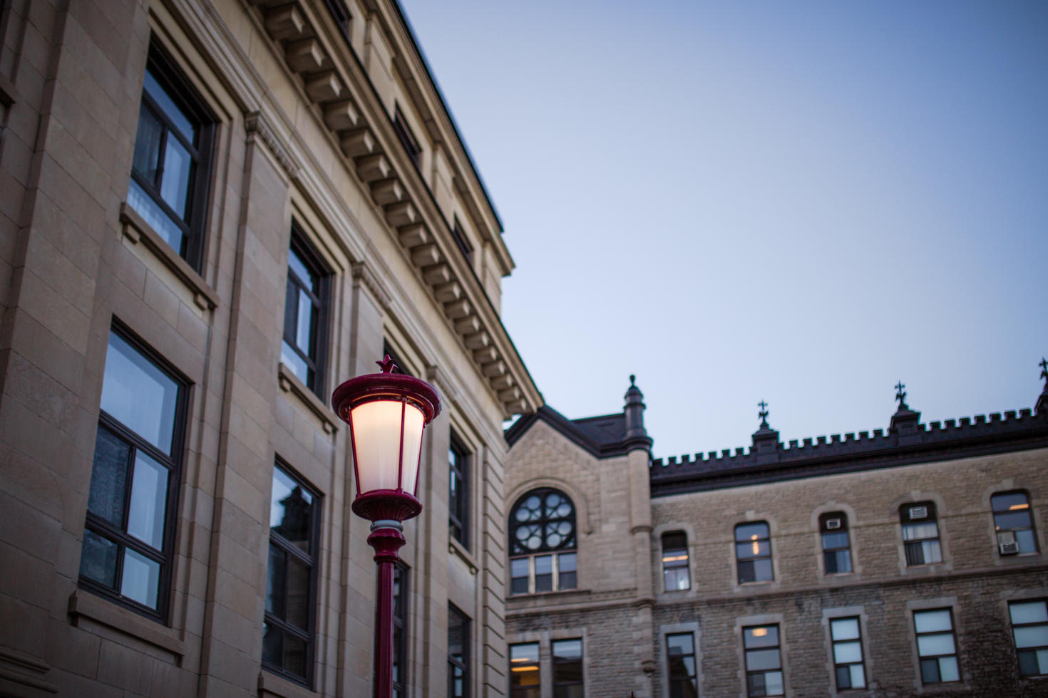 Campus building with red street lamp.