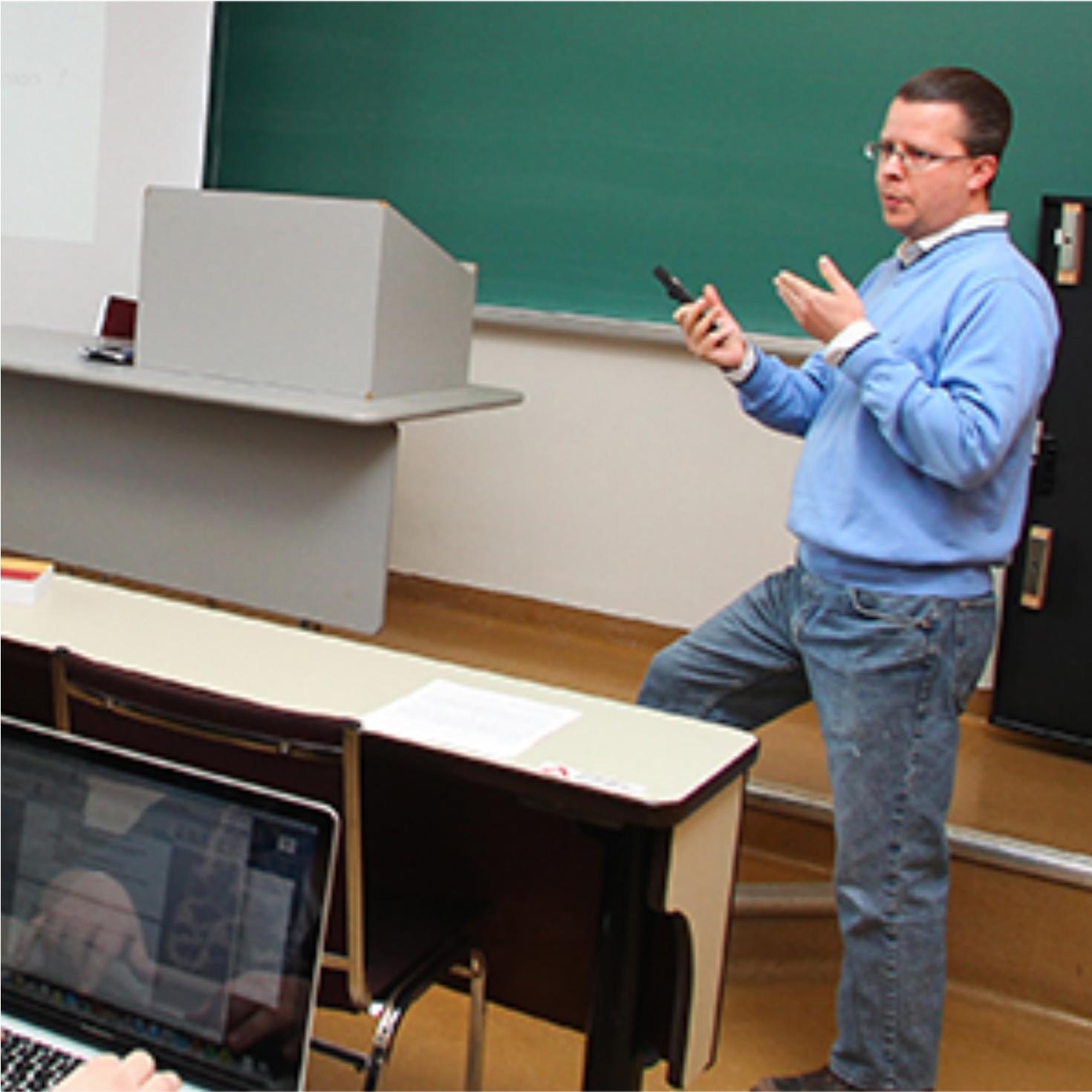 Professor teaching in classroom.