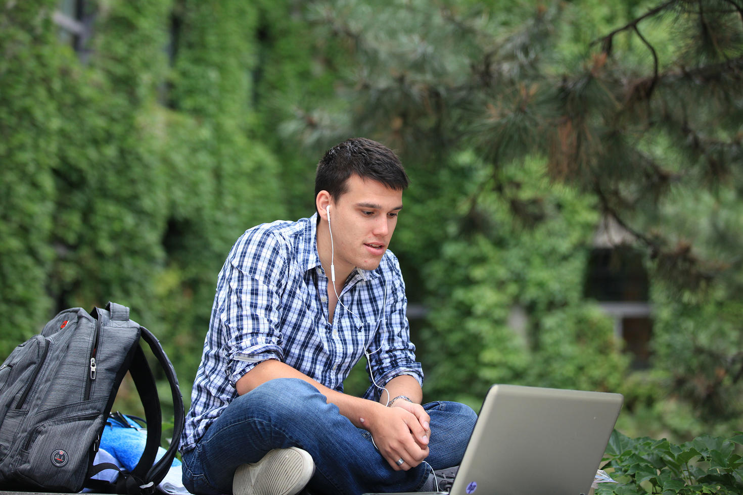 Male student on his laptop