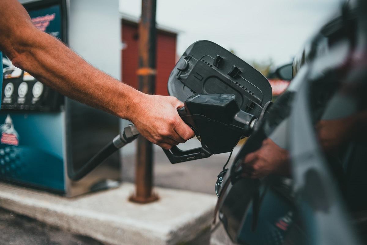 Man filling car at gas pump