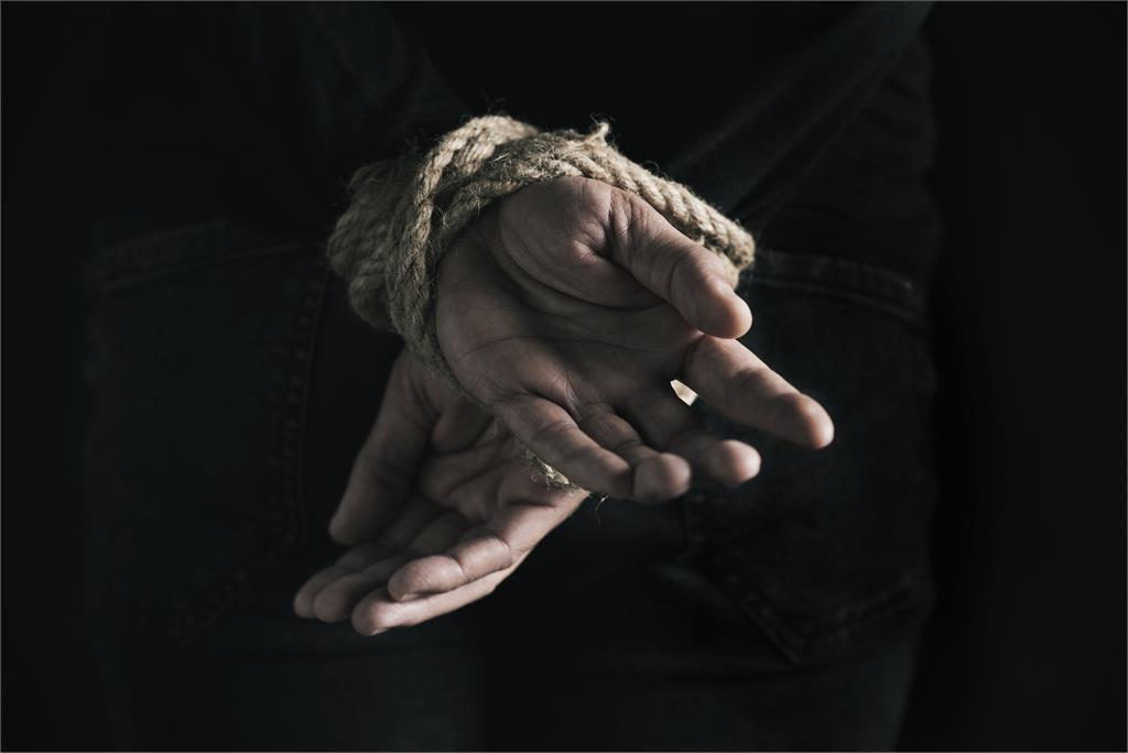 Hands tied with a rope