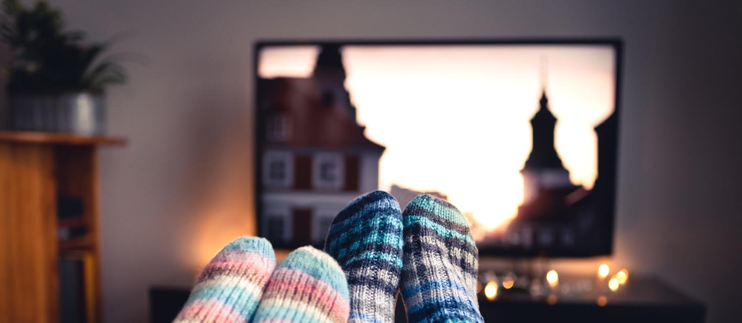 feet in front of a television