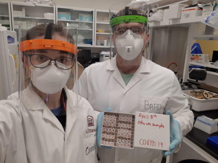 Students monitoring wastewater samples in lab