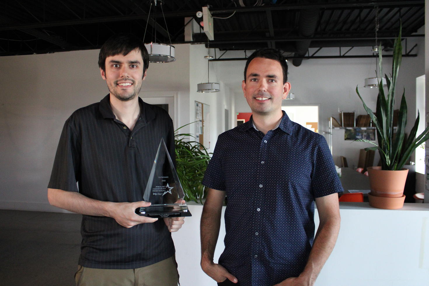Charles Blouin and Dominic Robillard present the innovation award
