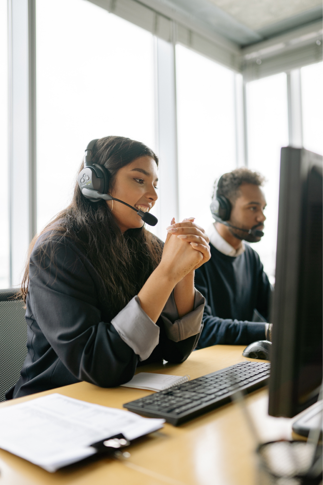 Women taking call on headset.