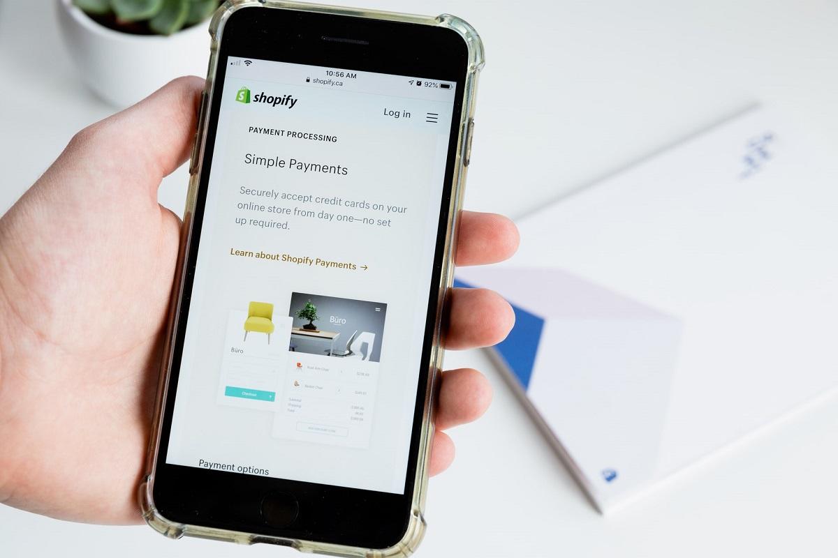 Mobile phone displaying Shopify site