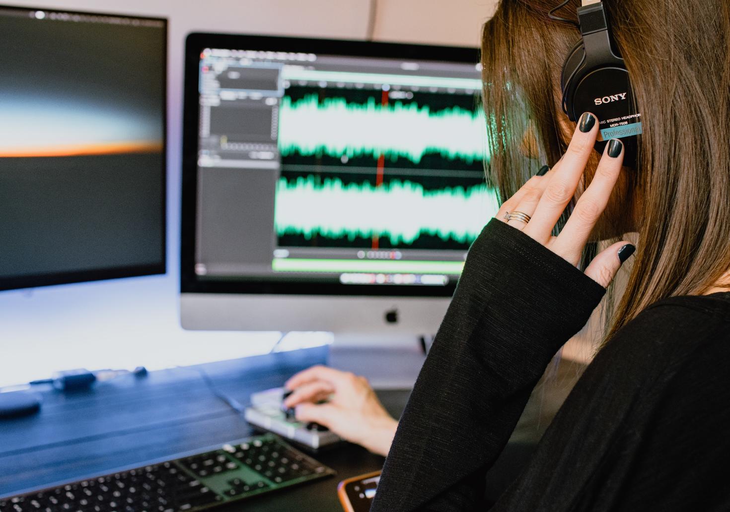 person working on voice synthesis on computer
