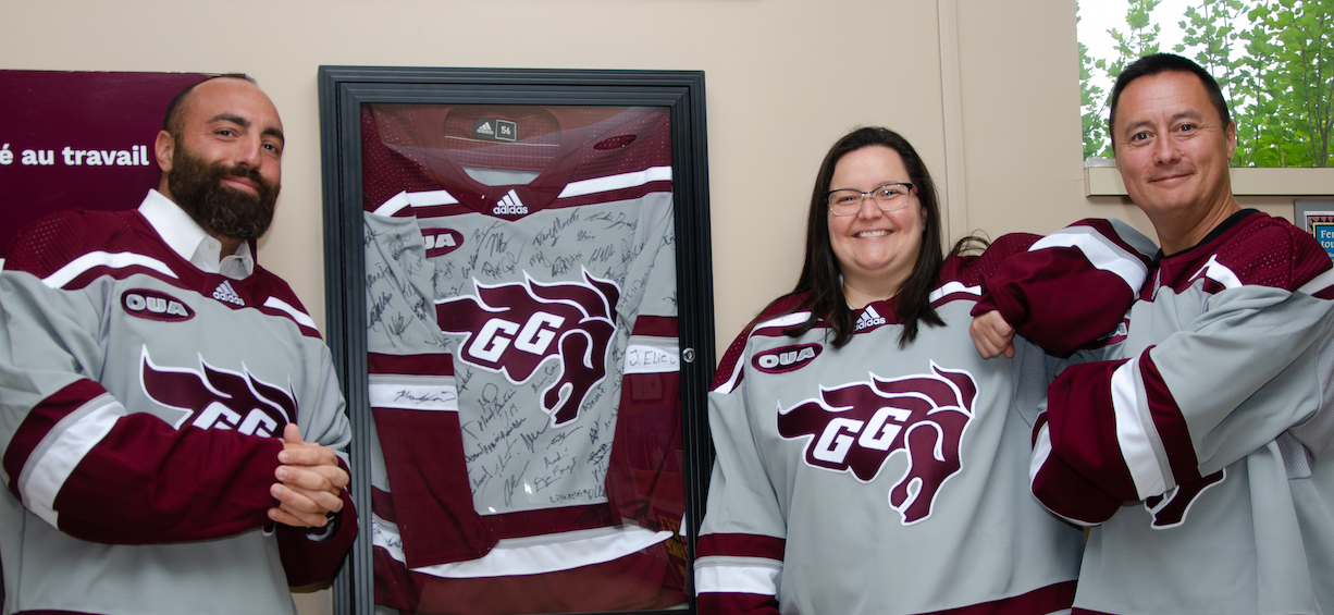 Employees wearing Gee Gees jersey