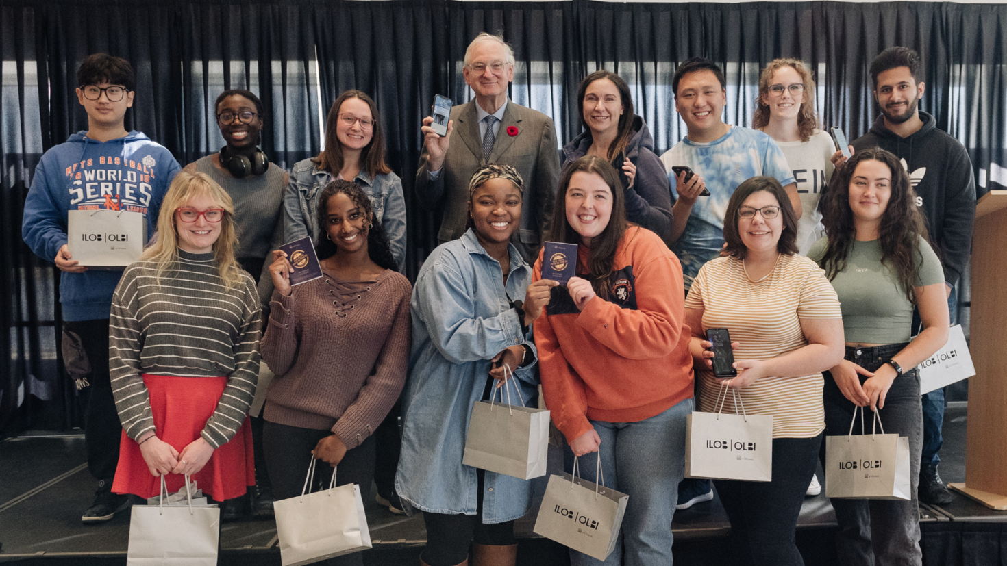 uOttawa's President with a group of students who received a prize for testing the app