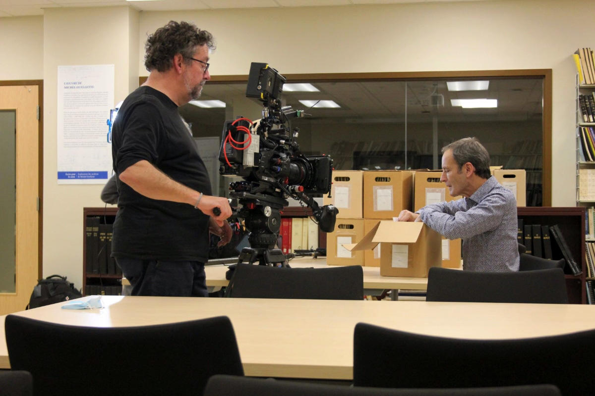 A man using a camera in the offices of the CRCCF