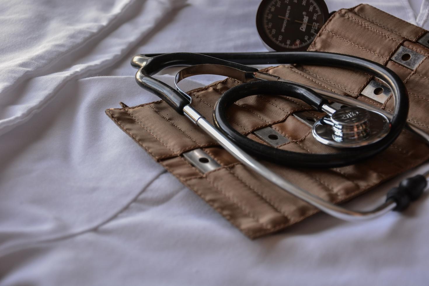 Doctor's tools, including stethoscope and blood pressure gauge