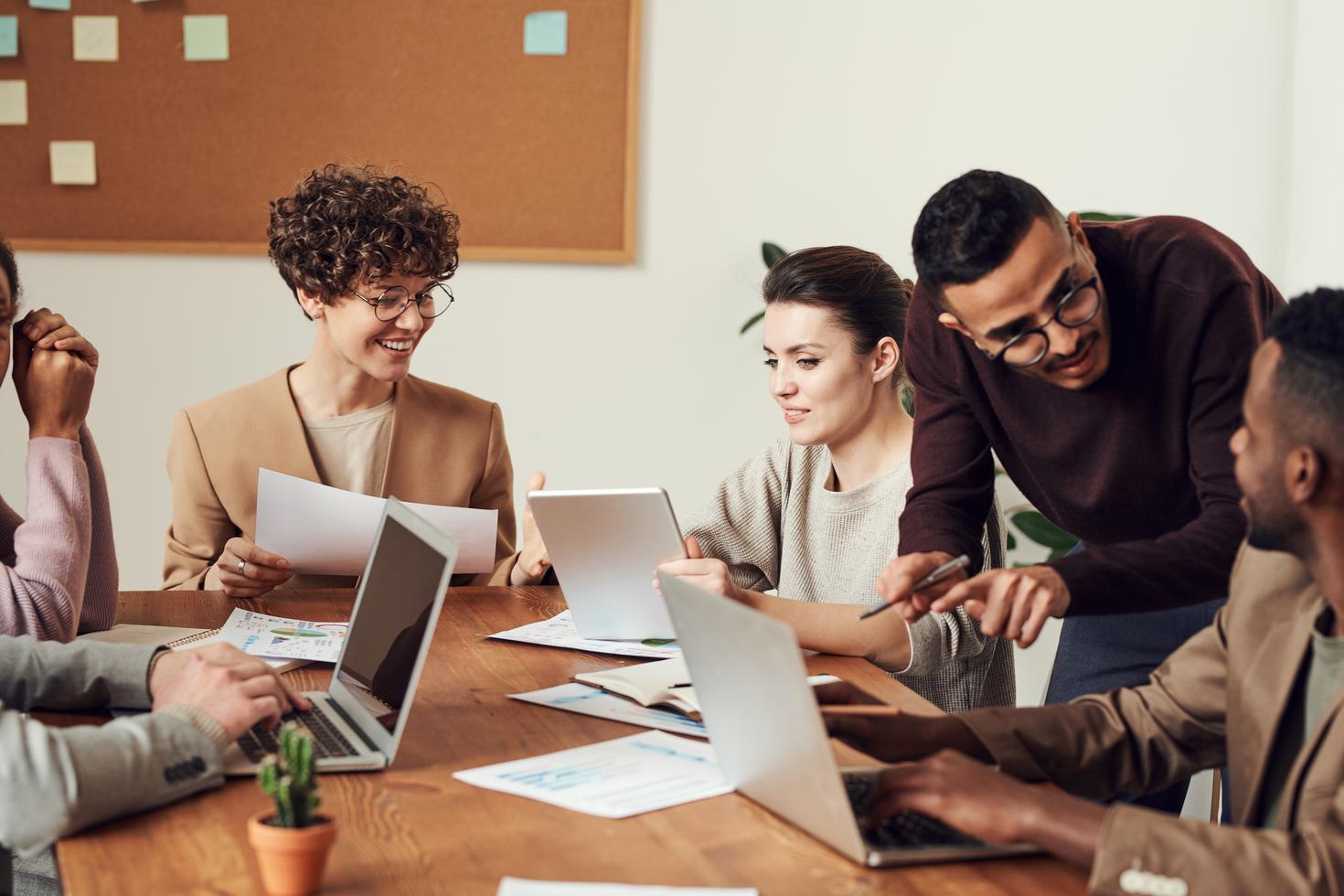 Shot of a group of businesspeople going through paperwork together around a table