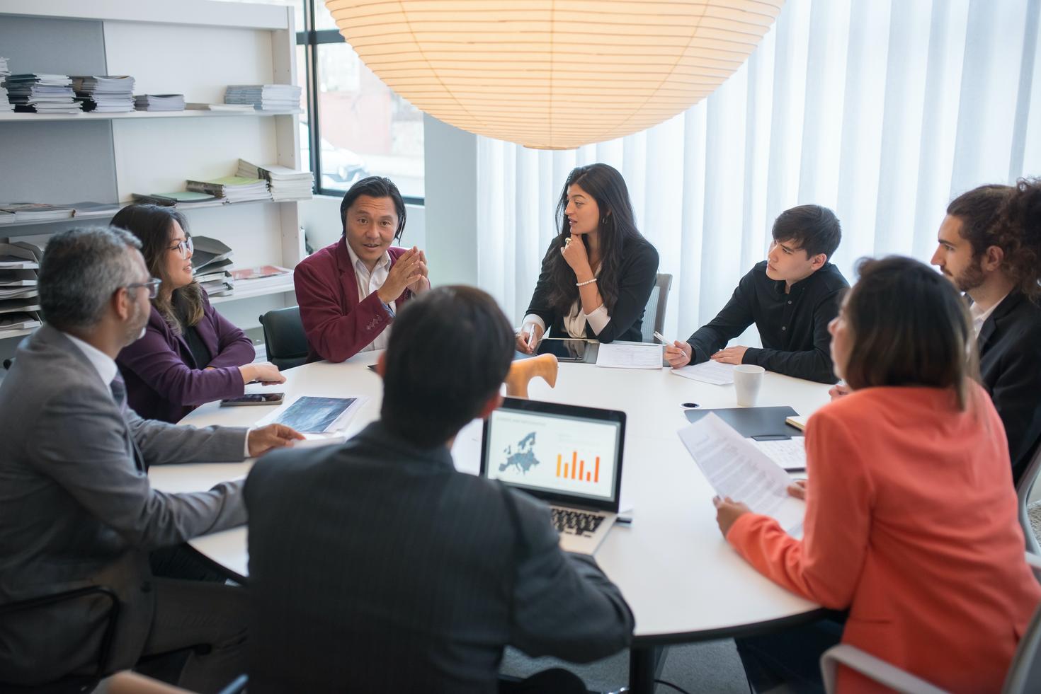 Group of people sitting around a table planning.
