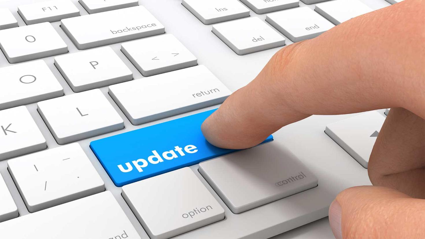 Keyboard with a big blue button saying "update" and a finger hovers over this button.
