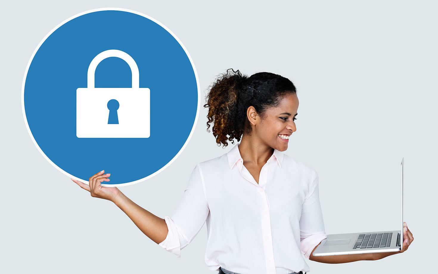 Woman holding a laptop.