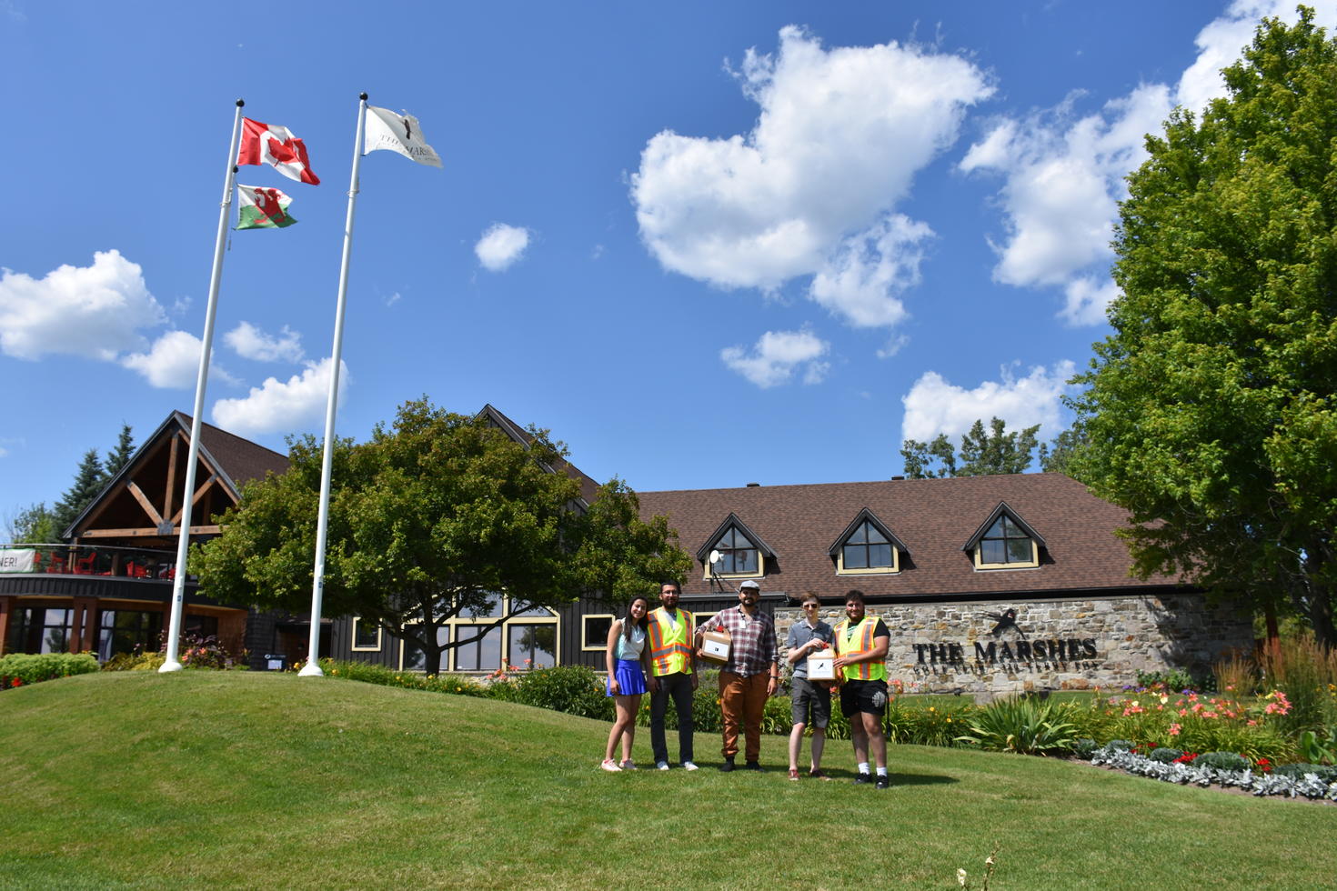 Zainab and Mohammed in front of Marshes golf course in Kanata.