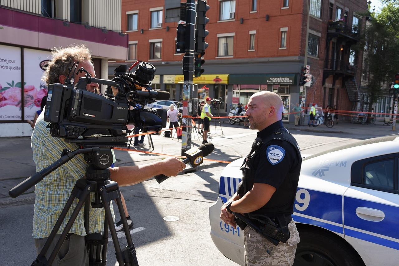 TV journalist interviews Montreal police officer