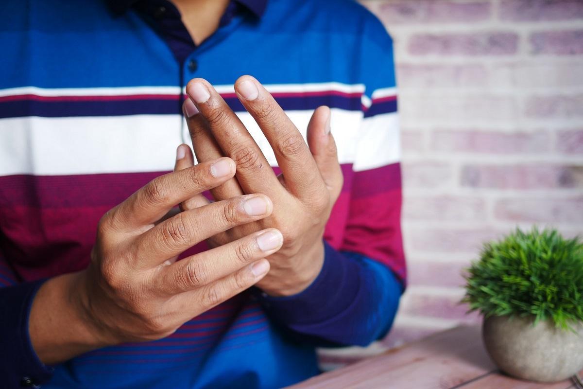 Man cradling hands