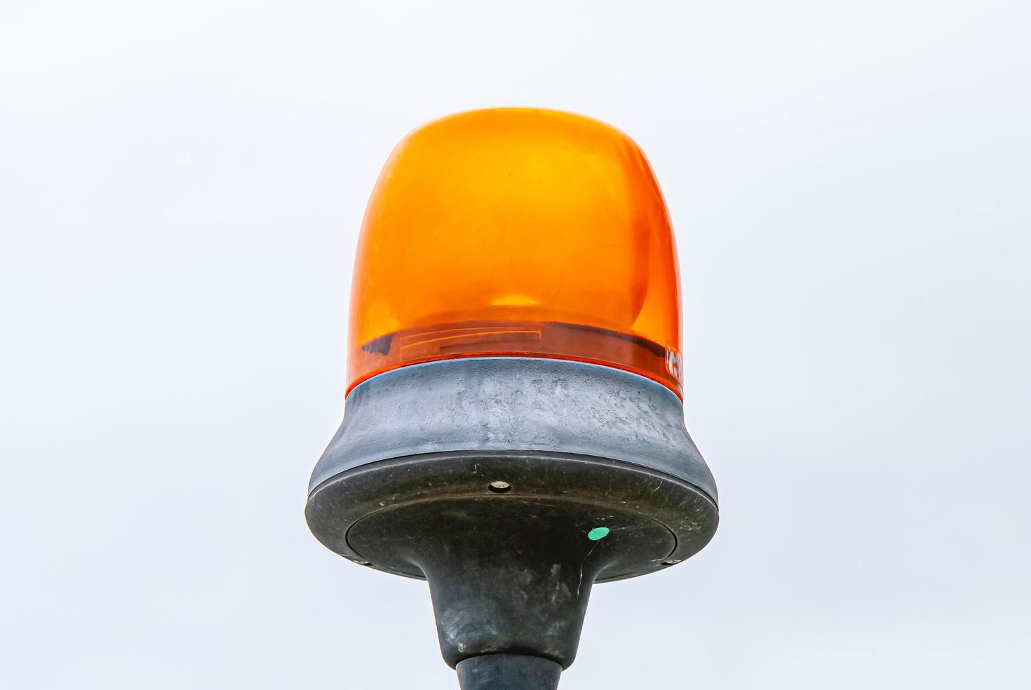 Orange warning light atop pole