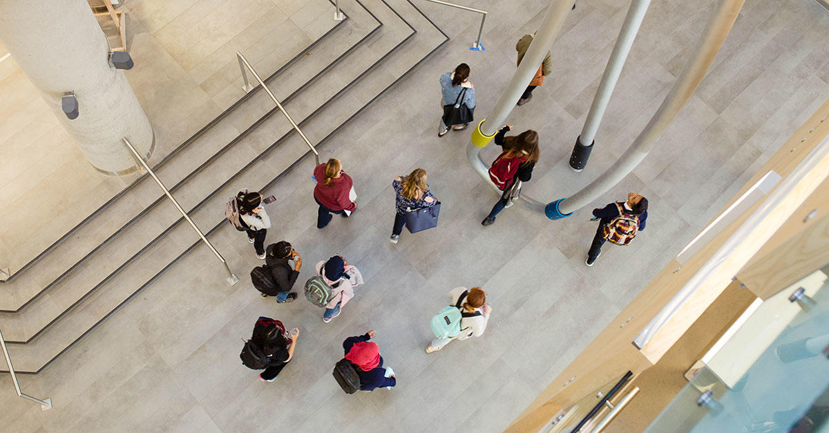 A bird's-eye view of a group of students walking in CRX