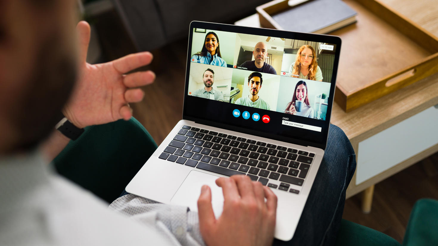 A person talking to another persons online using a laptop