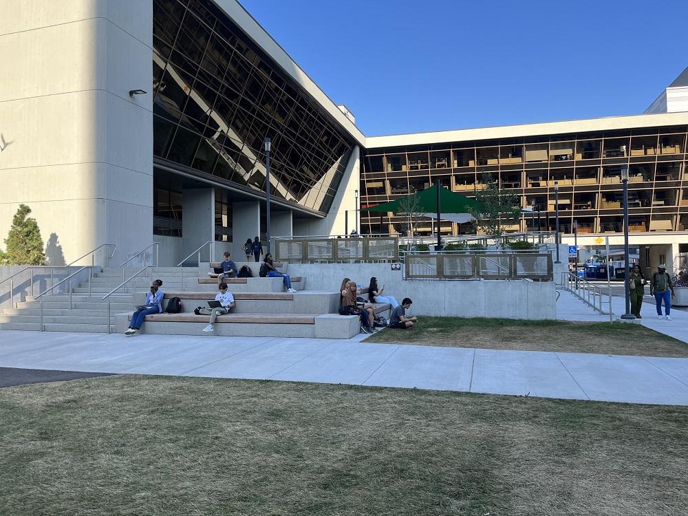 Students gathering at the integrated seating levels at Montpetit terrace