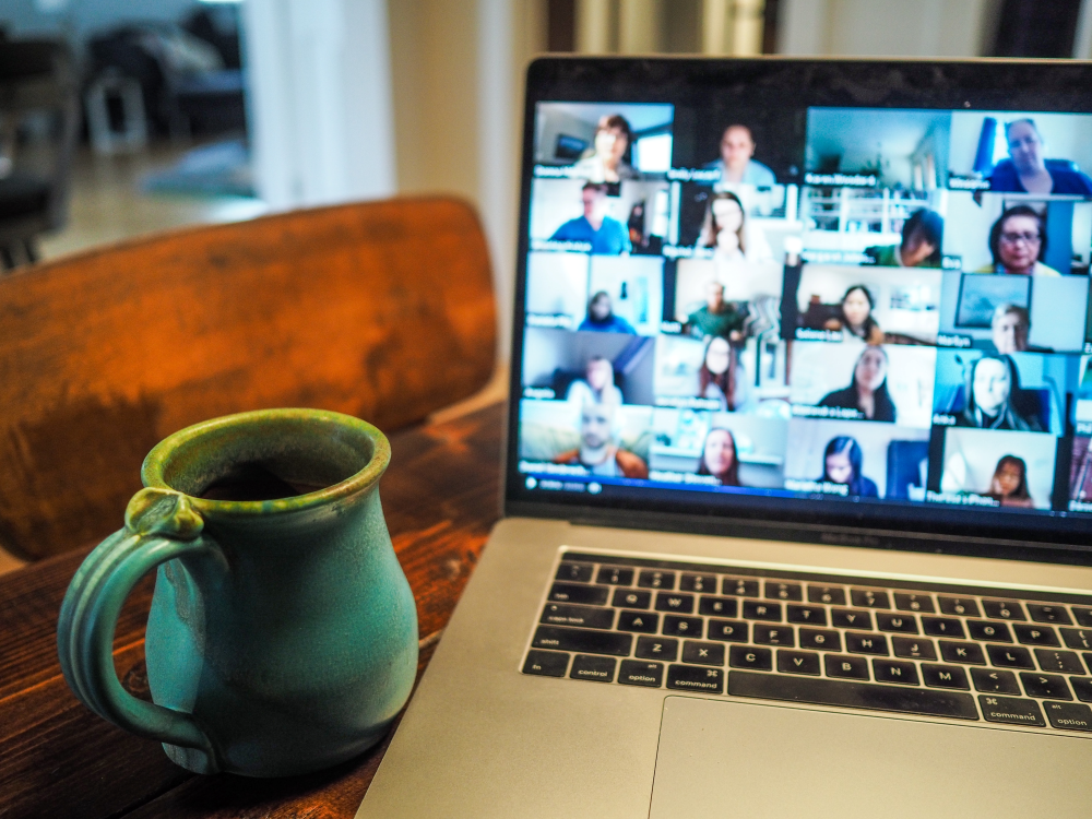 a picture of a laptop and a cup of coffee