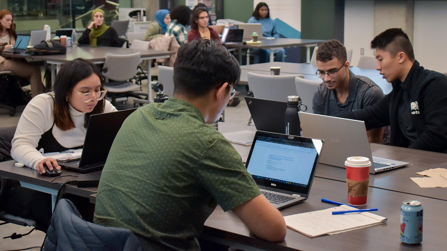 Students working in the Entrepreneurship Hub space