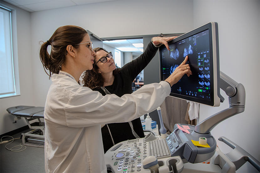 Linda McLean and postdoctoral researcher Marina Petter Rodrigues examining an ultrasound of a patient’s pelvic floor.