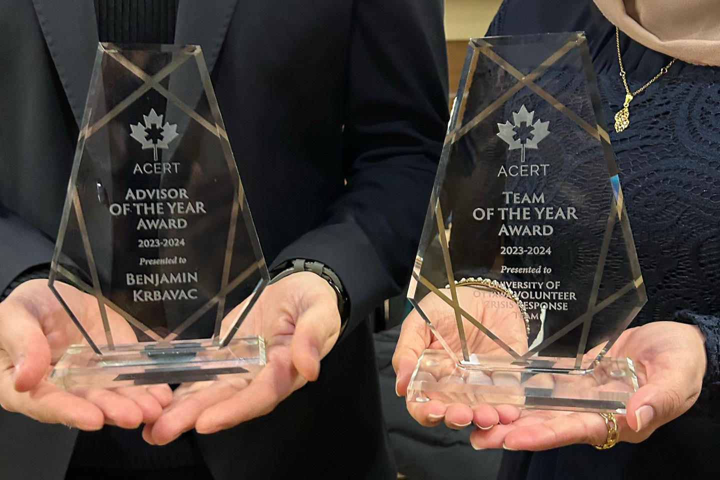 VCRT team members holding awards