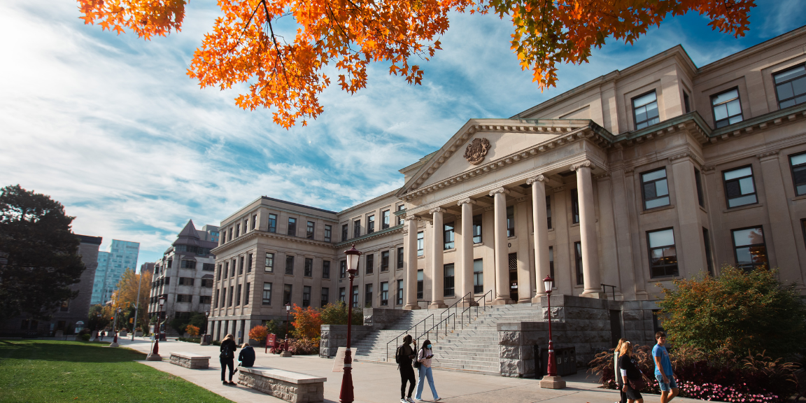 Tabaret Hall with a tree with leaves changing colors in the fall