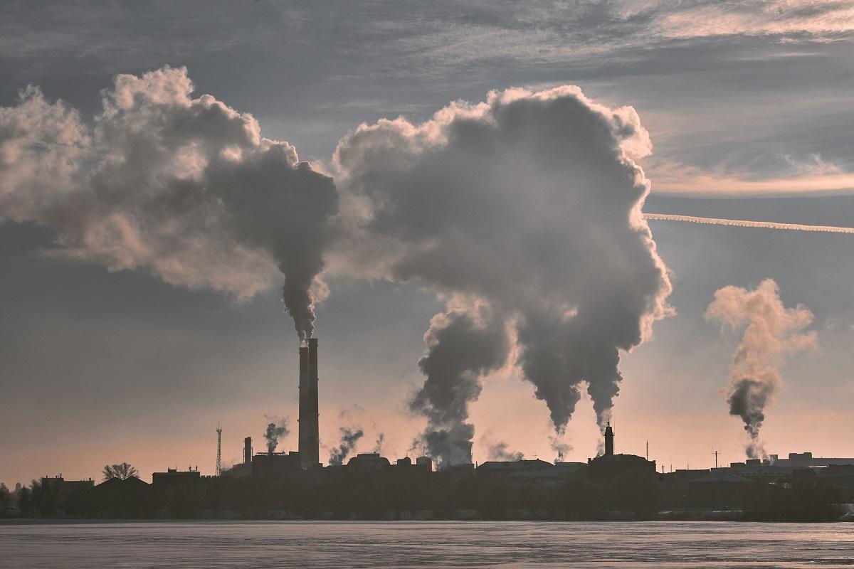 Smokestacks billowing at factory