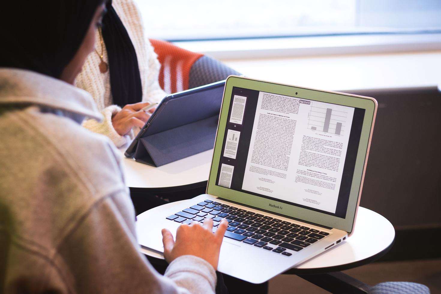 A student using a laptop