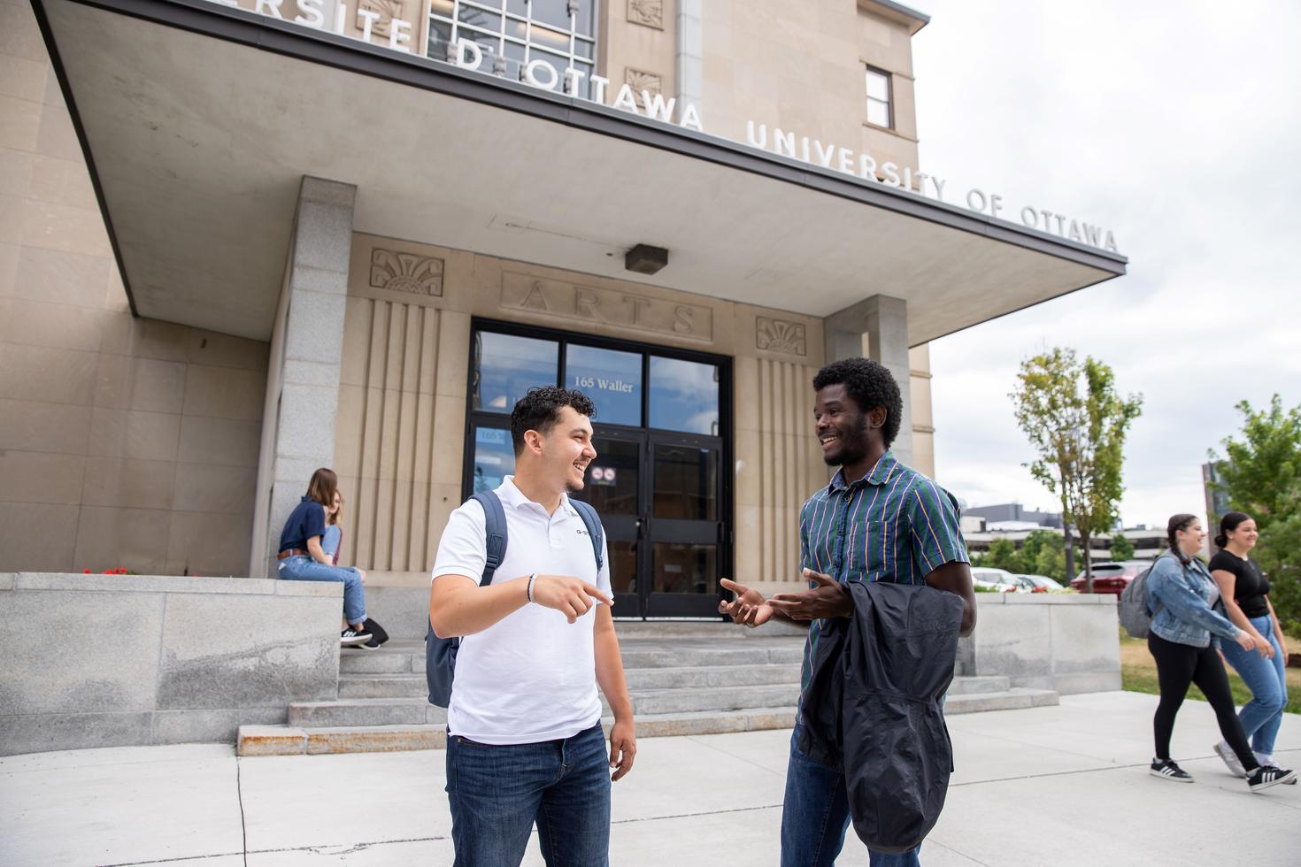 students talking to each other on campus