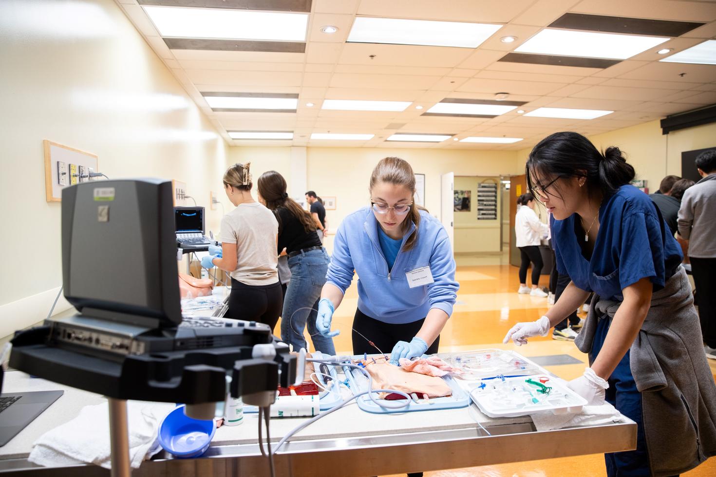 Two medicine students working at a table
